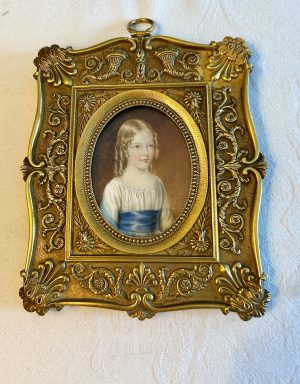 A Fine Regency Portrait Miniature of a Young Girl in a White Dress wit a Wide Blue Sash c.1820